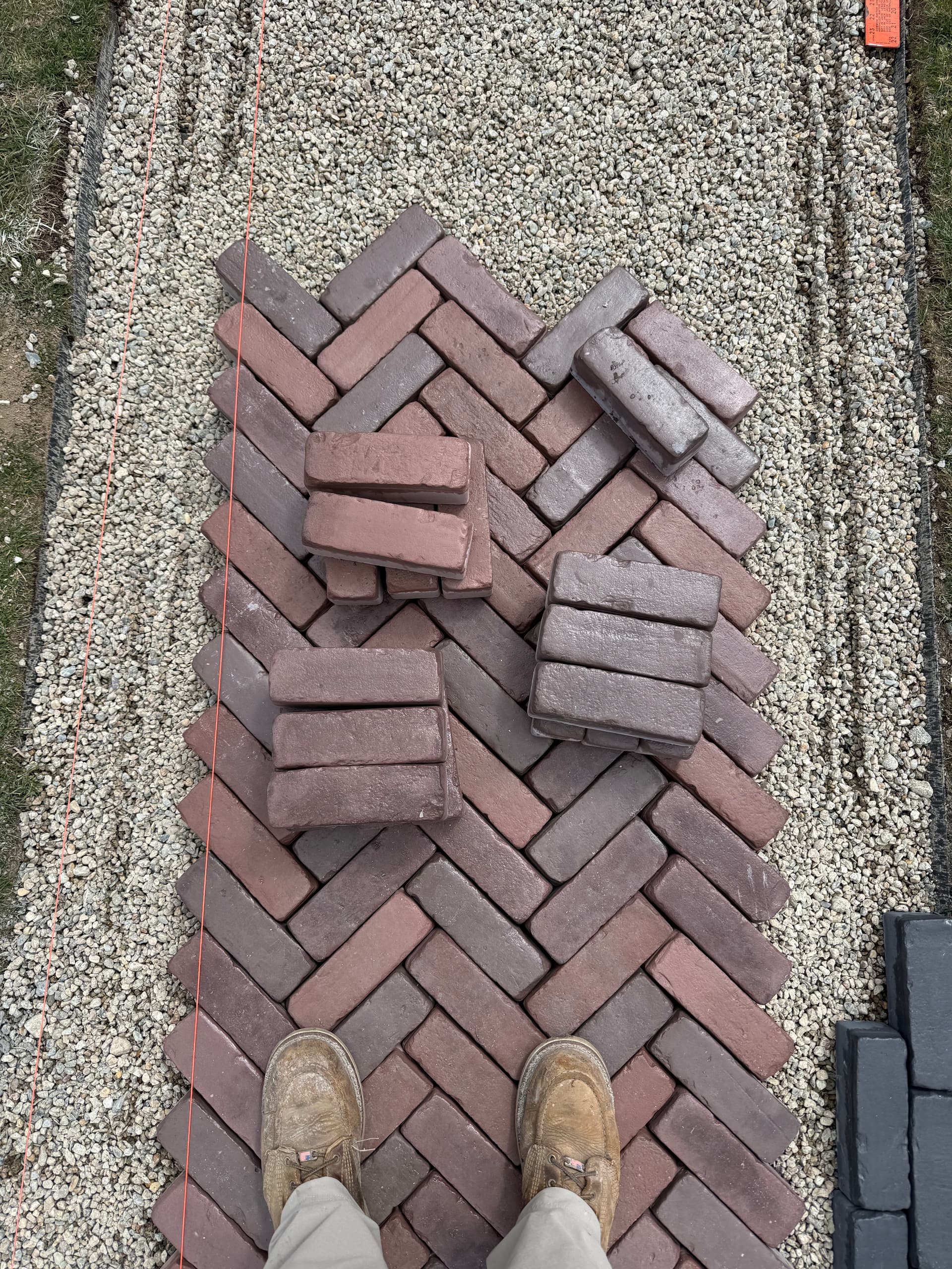 Gallery photos for Unilock Tricolor Red Herringbone Walkway with Copthorne Basalt Border: Image #1