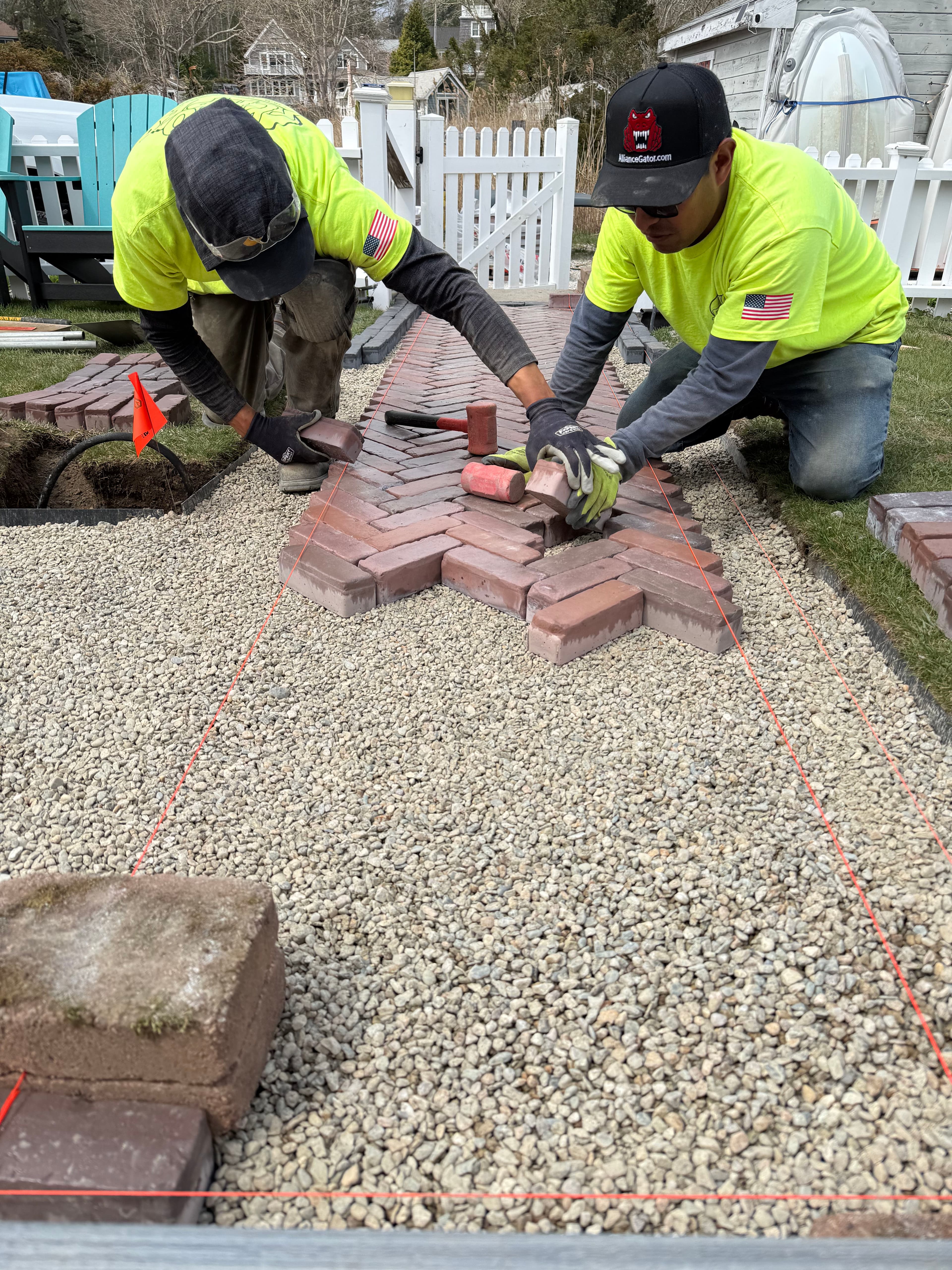 Project Unilock Tricolor Red Herringbone Walkway with Copthorne Basalt Border image