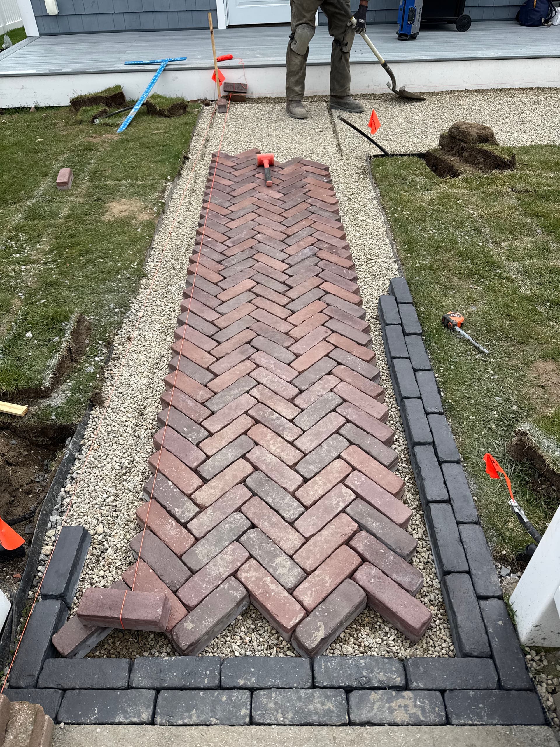 Gallery photos for Unilock Tricolor Red Herringbone Walkway with Copthorne Basalt Border: Image #3